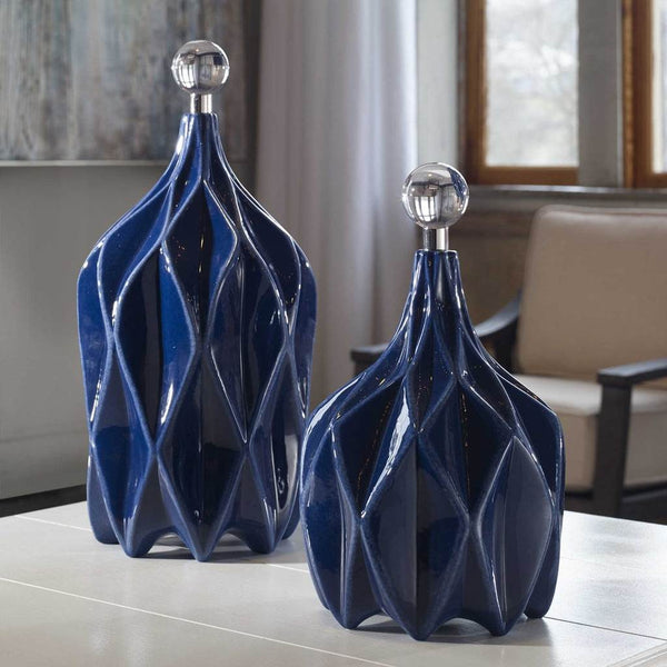 Decorative View. Modern style emanates from this set of decorative ceramic bottles with an embossed 