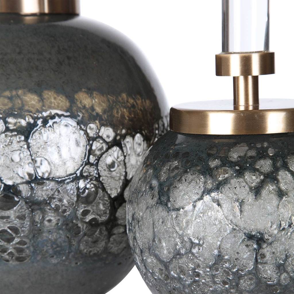 Close-Up View. Set of two art glass bottles feature organic texture with an iridescent blue-gray hue