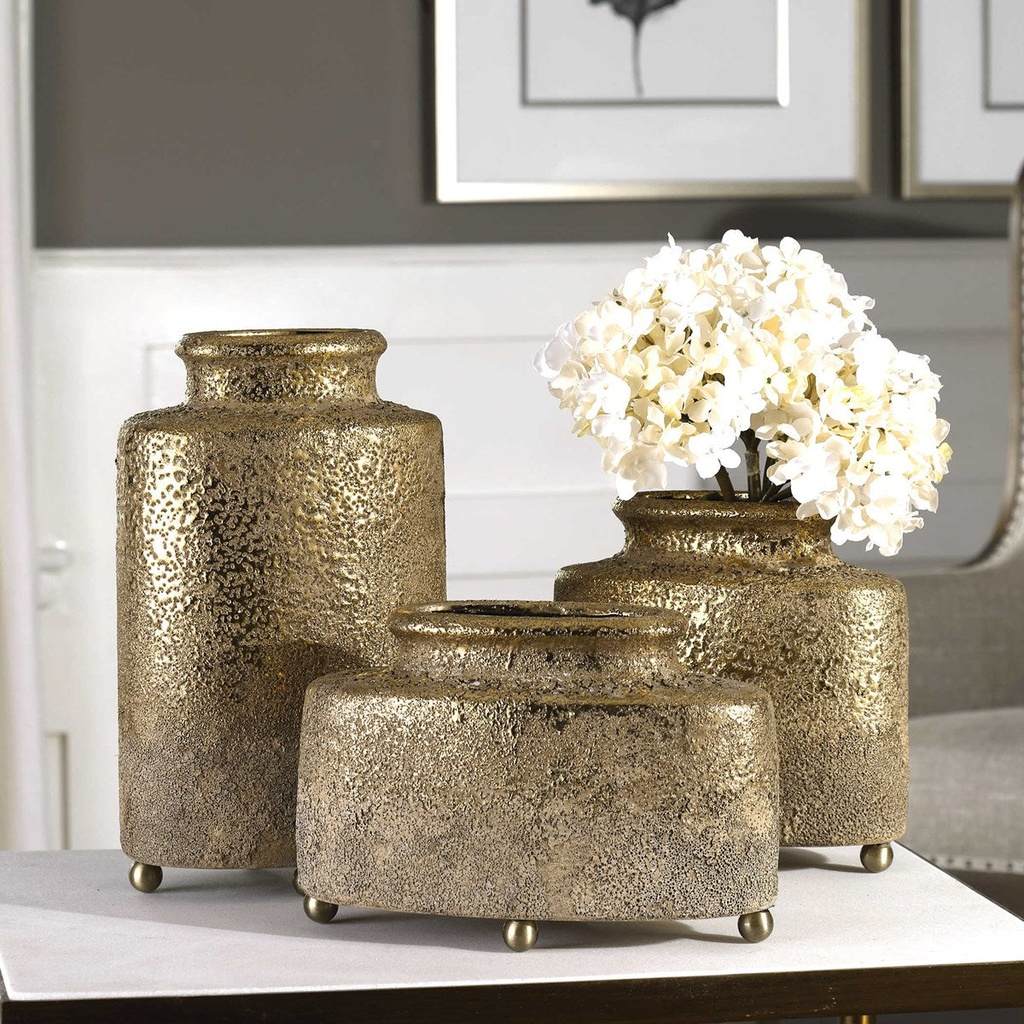 Decorative View. Roughcast ceramic vases, dipped from the top in a metallic golden glaze. Each vesse