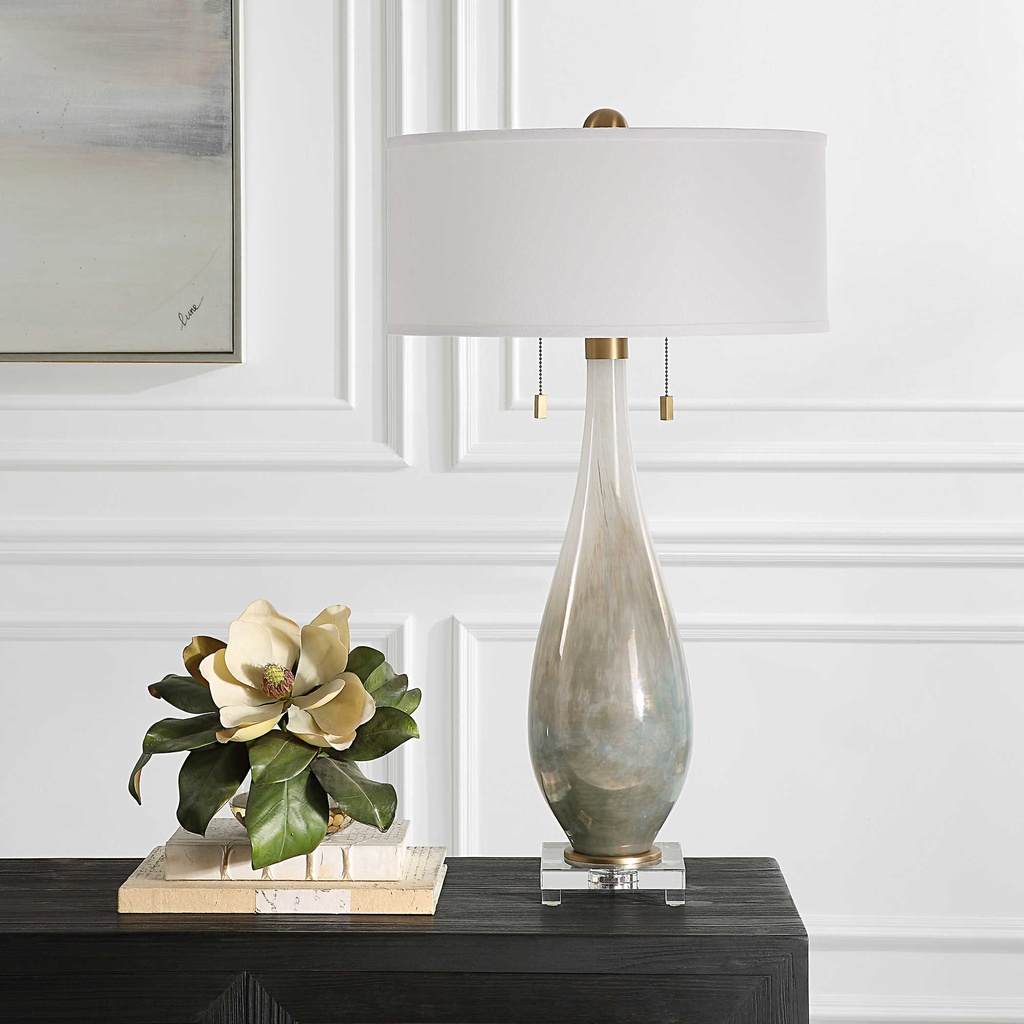 Decorative View. The Cardoni Table Lamp is created from gloss white glass featuring metallic smoked 