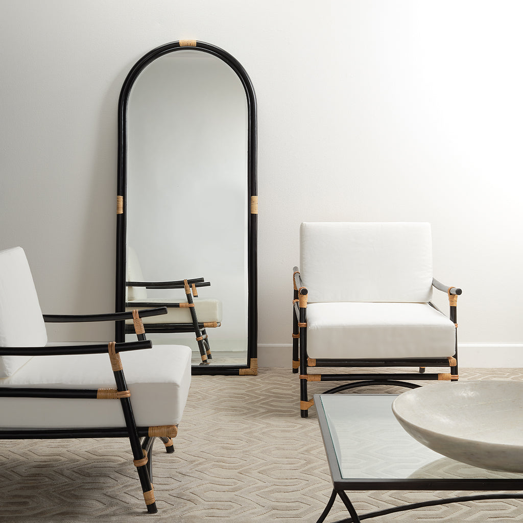 Decorative View. This gently arched, full length floor mirror’s rattan frame is subtly embellished w