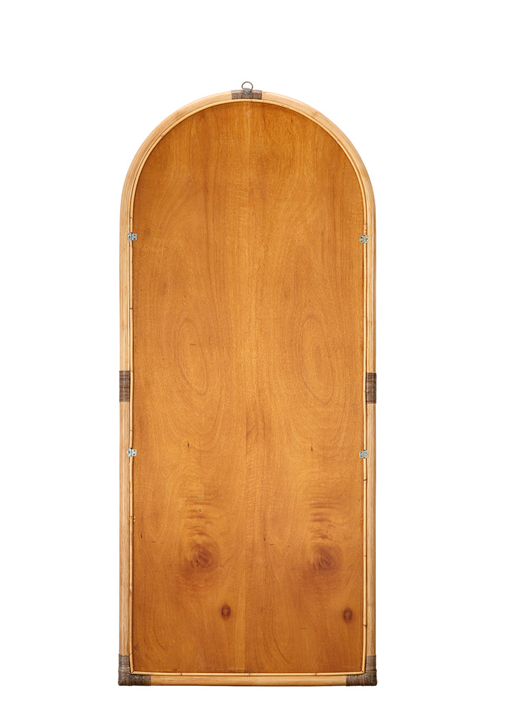 Back View. This gently arched, full length floor mirror’s rattan frame is subtly embellished with de