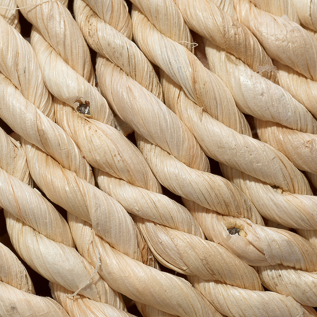 Close-Up View. Hand-made out of natural wood and wrapped in rattan, this set of decorative balls are