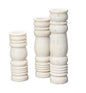 Front View. Beautifully artisan-carved of cool white stone, this set of three candlesticks pair clas