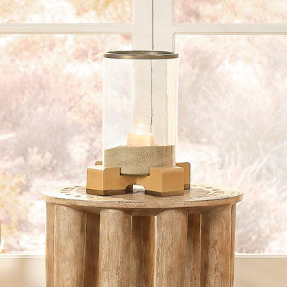 Decorative View. Edgy, elemental materials balance the softness of a candle’s glow in this contempor