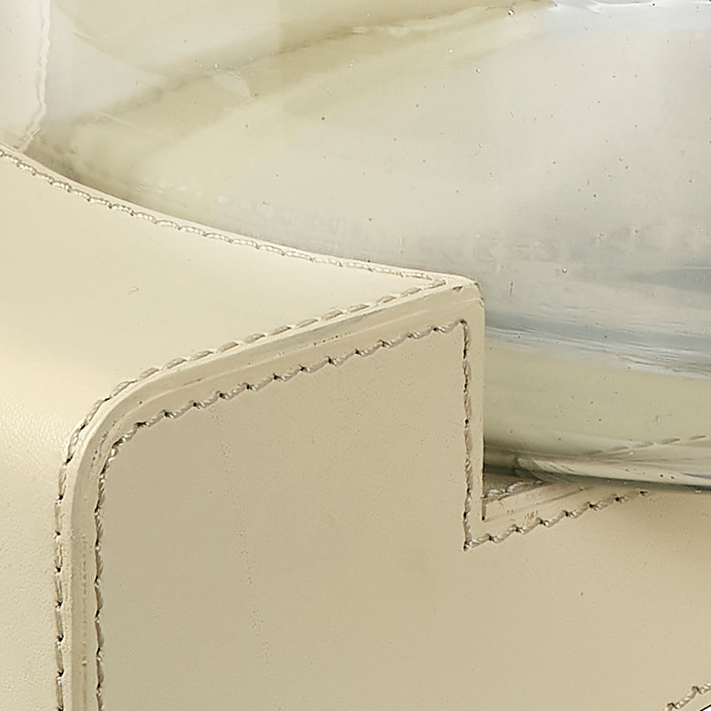 Close-Up View. Edgy, elemental materials balance the softness of a candle’s glow in this contemporar