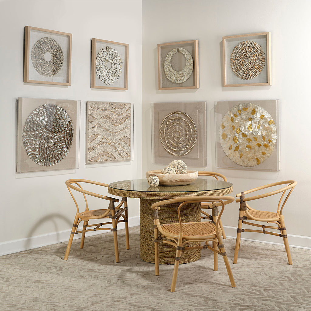 Decorative View. An assortment of natural simnia shells are arranged into shrinking concentric circl