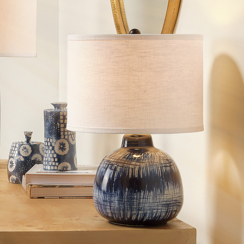 Decorative View. Inspired by Japanese ceramics, this lamp is a stunning ceramic accent that features