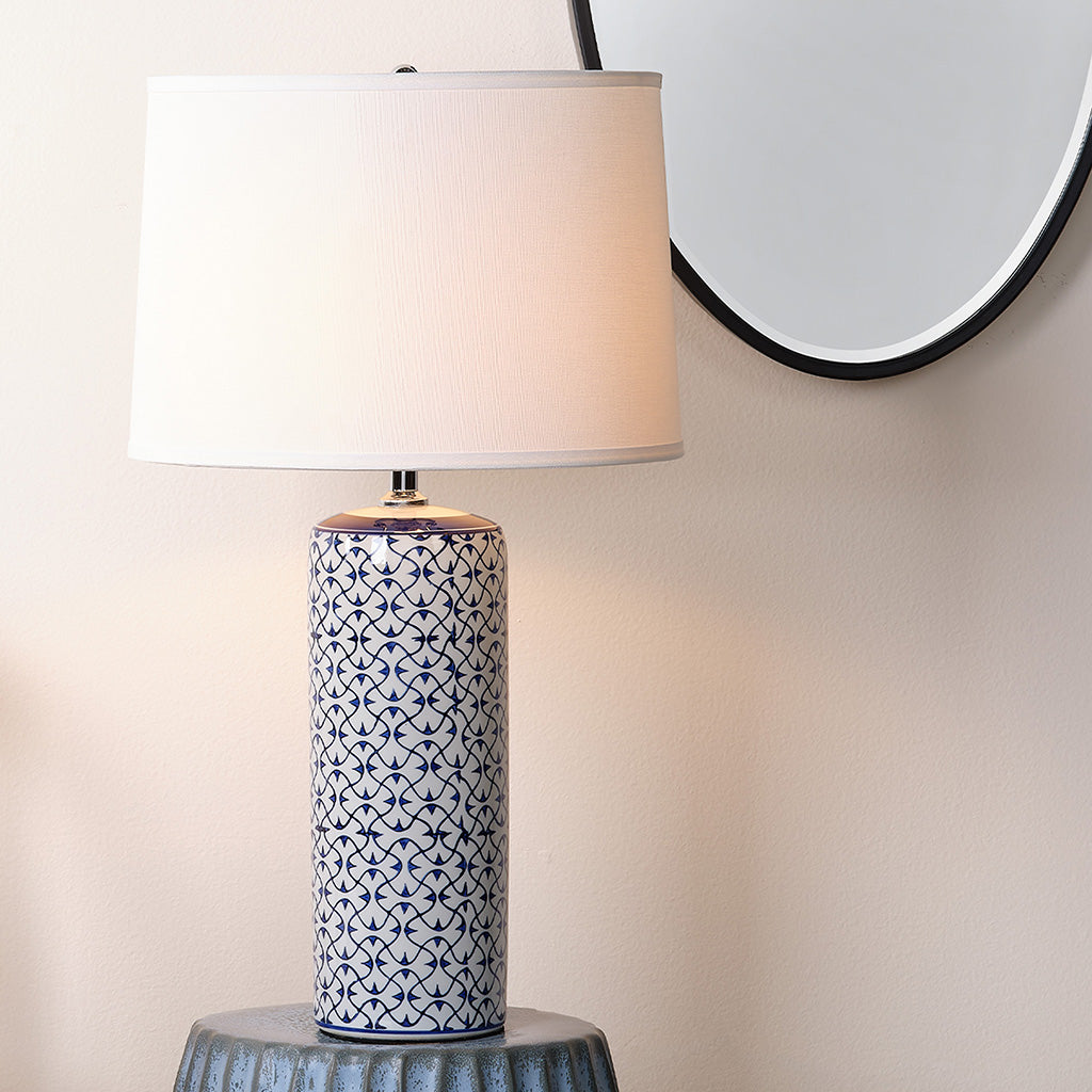 Decorative View. The delicate blue pattern on this ceramic table lamp is painted by hand for an arti