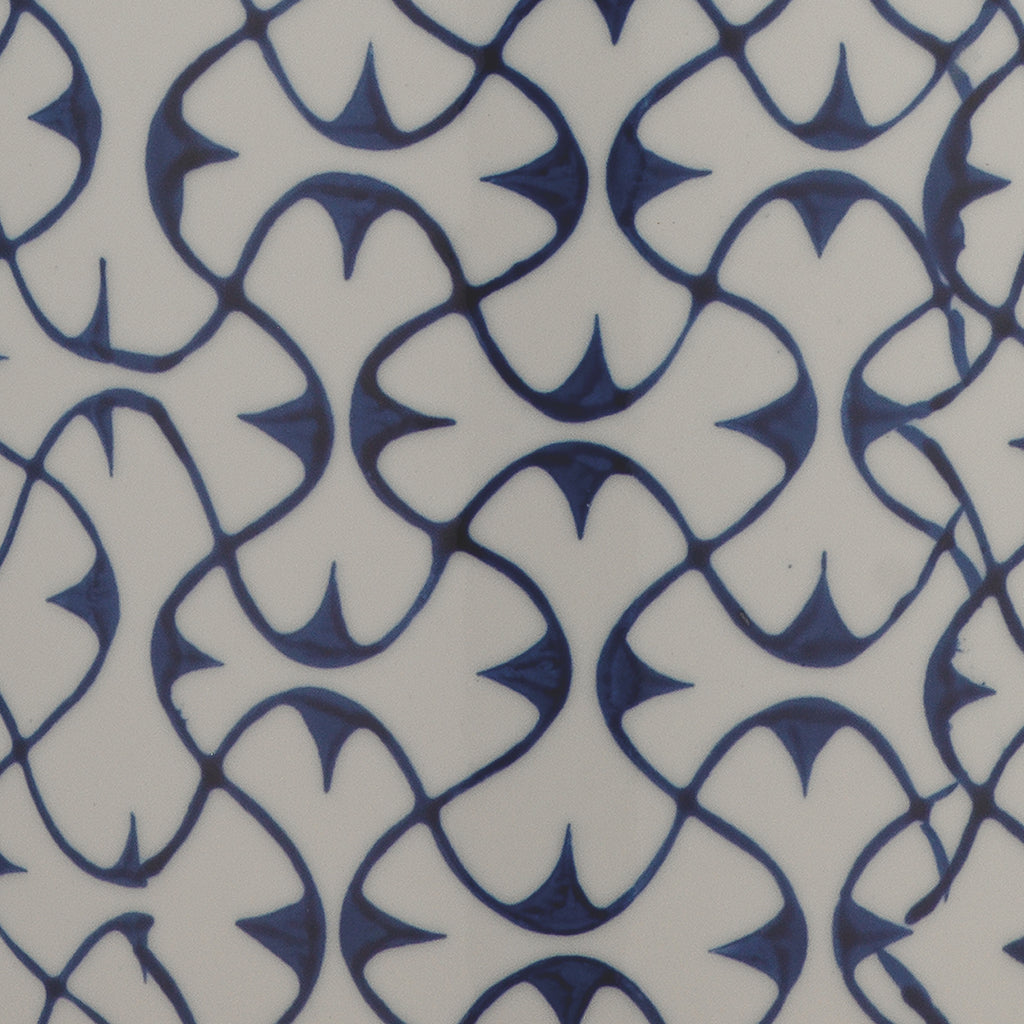 Close-Up View. The delicate blue pattern on this ceramic table lamp is painted by hand for an artisa