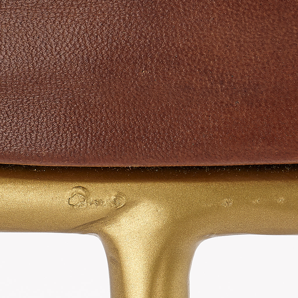 Close-Up View. These unique stools feature a comfortably padded round seat in top-quality leather th