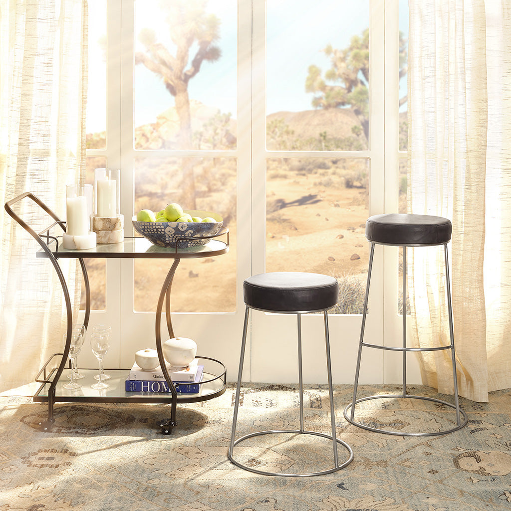 Decorative View. These unique stools feature a comfortably padded round seat in top-quality leather 