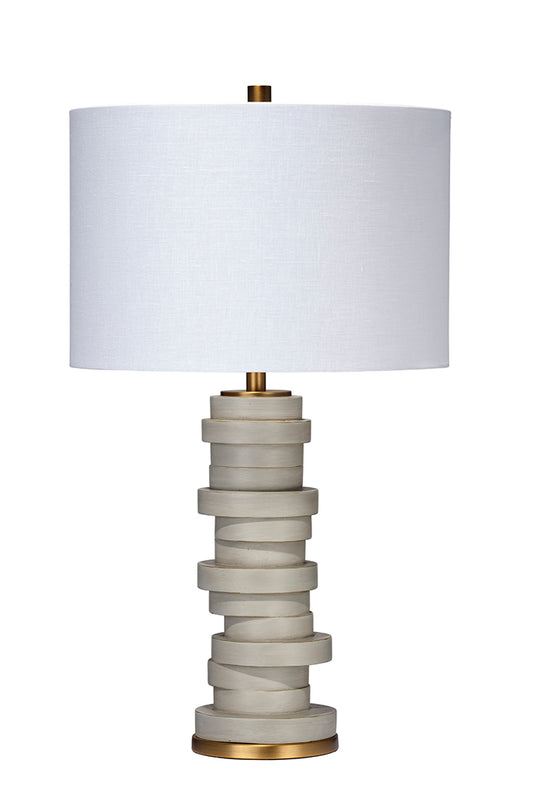 Front View. Discs of cement colored resin are stacked, seemingly haphazardly, in this whimsical lamp