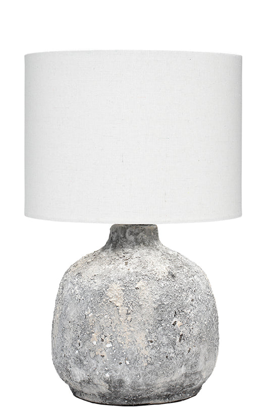 Front View. A look of the past with a modern feel, this table lamp features a simple ceramic silhoue