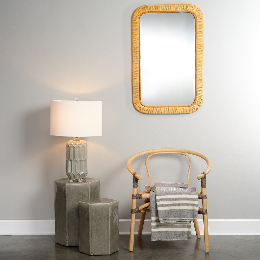 Decorative View. Placed at the end of a hallway or in an alcove, this mirror opens up its surroundin