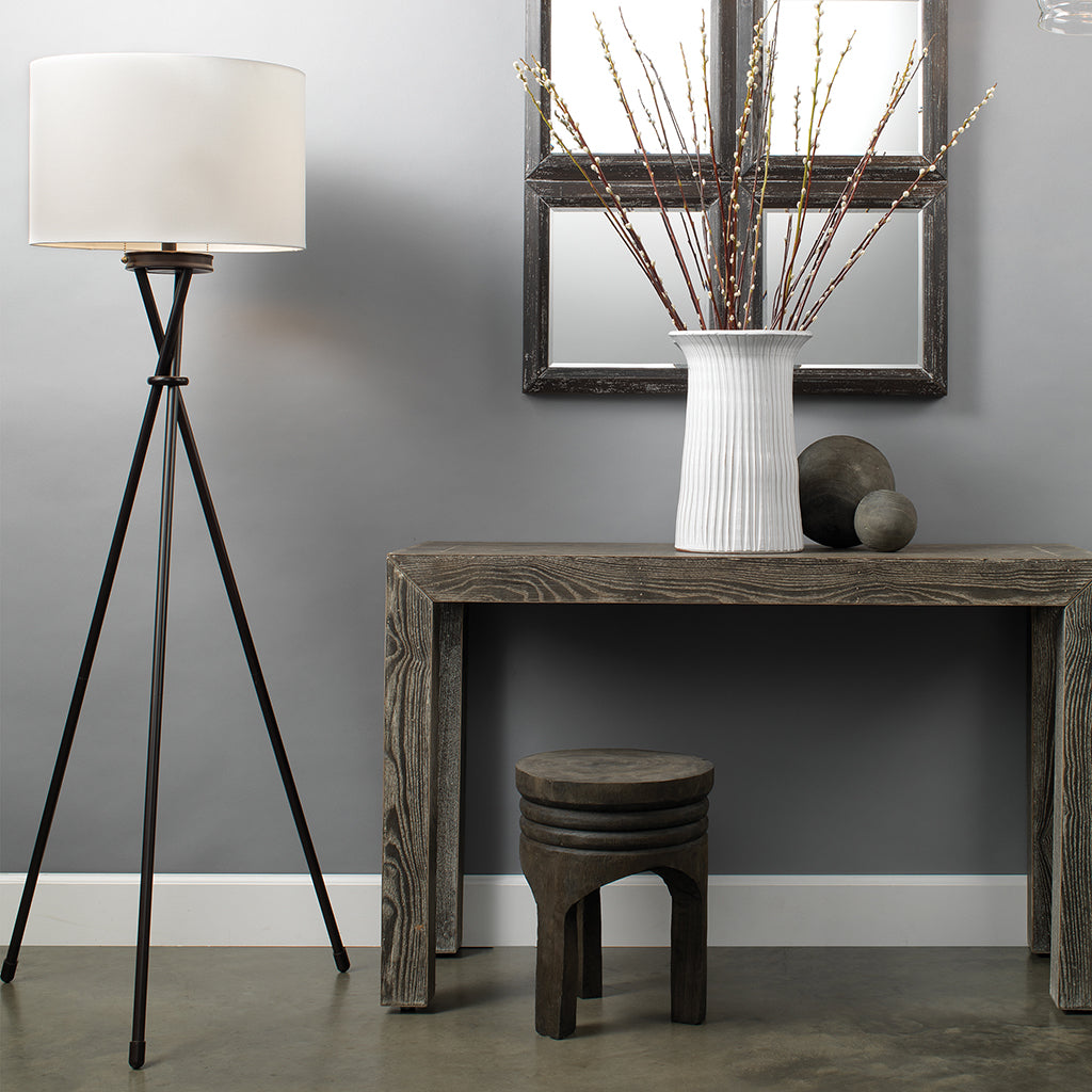 Decorative View. A contemporary take on the mid-century tripod, this floor lamp features three metal