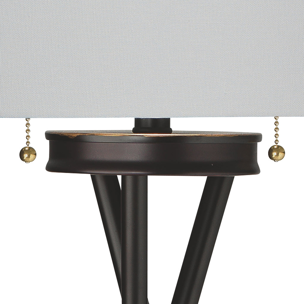 Close-Up View. A contemporary take on the mid-century tripod, this floor lamp features three metal l