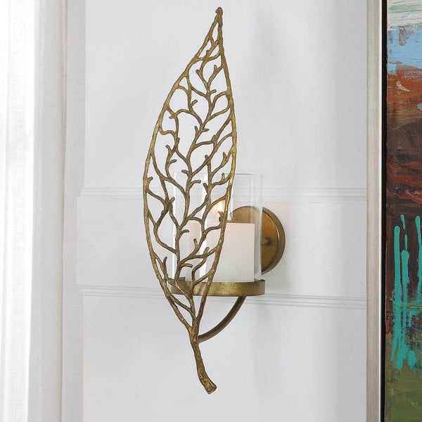 Decorative View. Echoing the intricate details of natural flora, this candle sconce is crafted from 