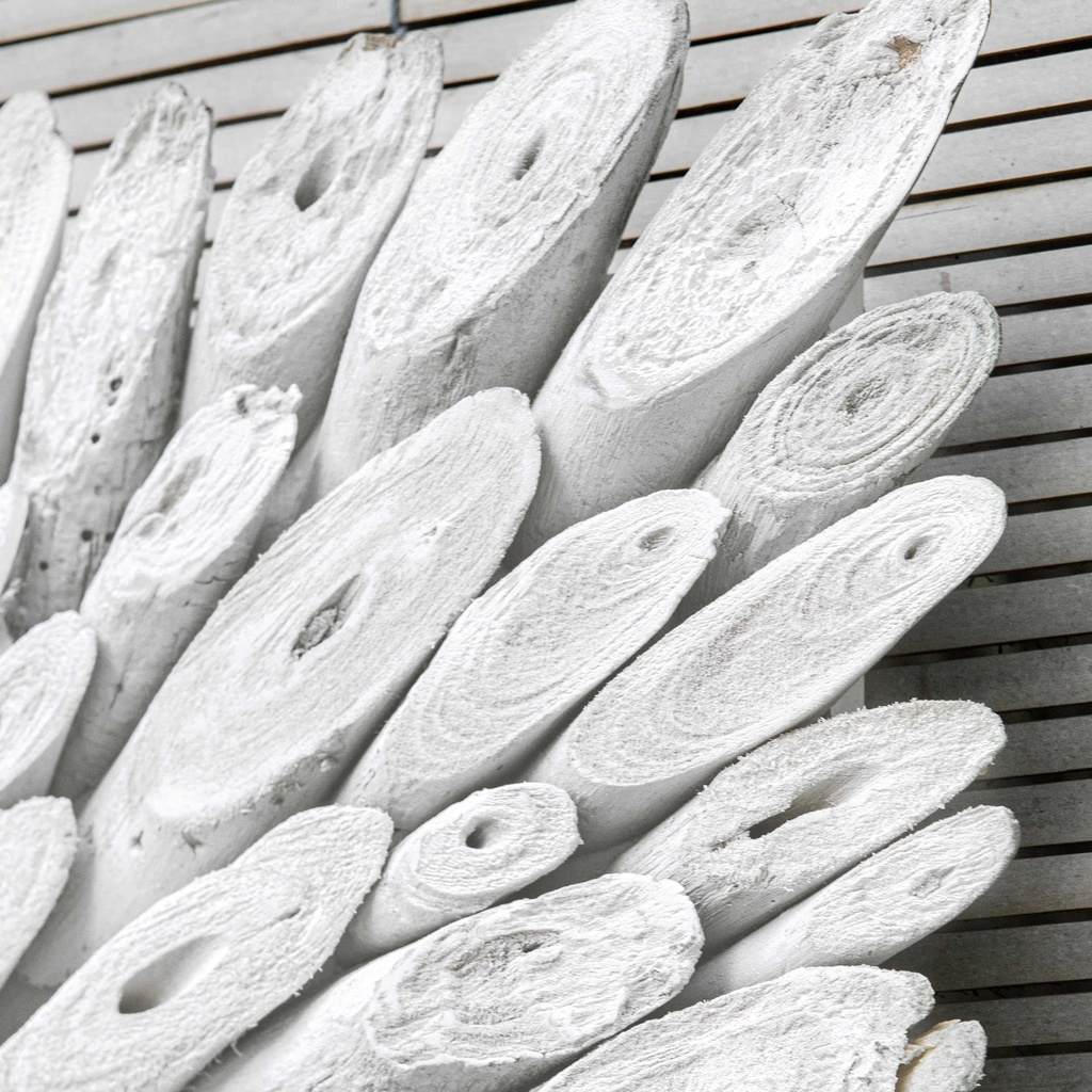 Close-Up View. The Bahama wood wall panel is handcrafted from individually cut natural driftwood pie