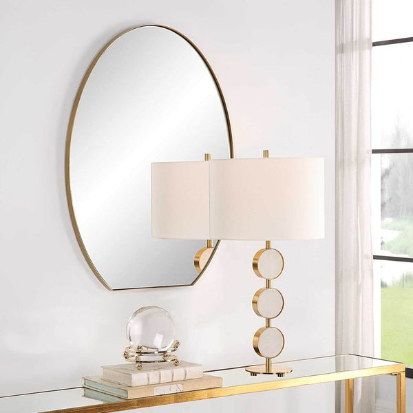 Decorative View. The Cabell is a sleek, contemporary, oval mirror with a flattened bottom. It featur