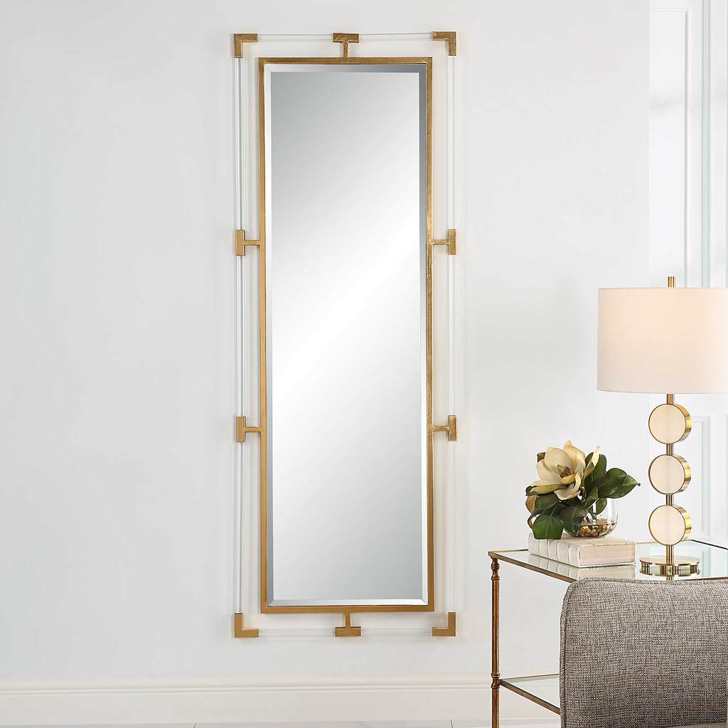 Decorative View. The balkan tall mirror features forged iron finished in a metallic gold leaf with s