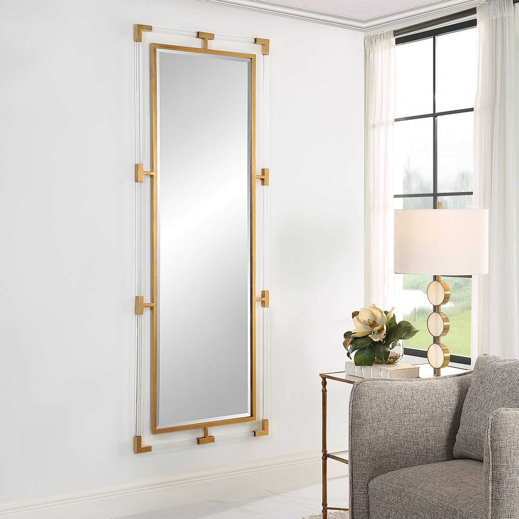 Decorative View. The balkan tall mirror features forged iron finished in a metallic gold leaf with s