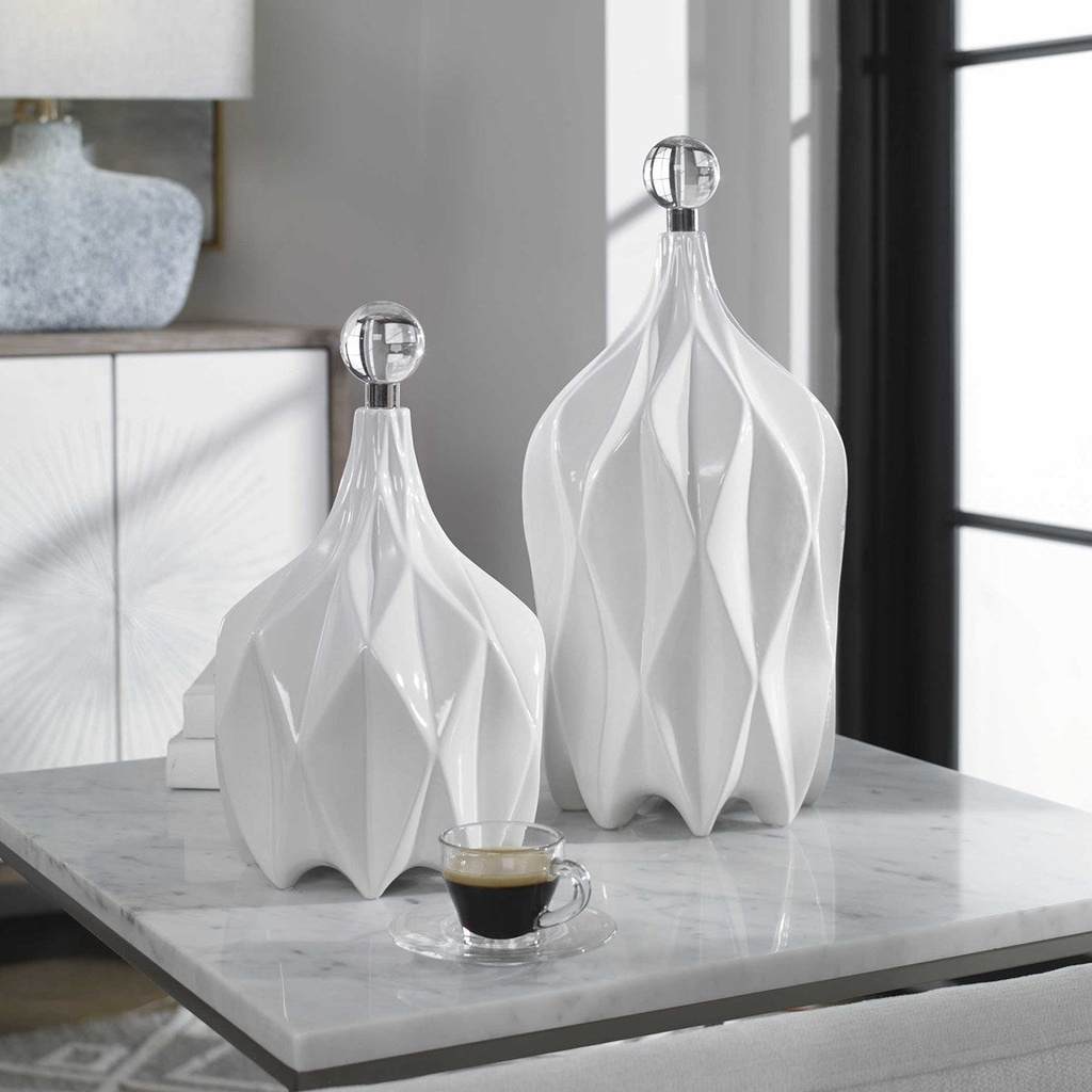Decorative View. Modern style emanates from this set of decorative ceramic bottles with an embossed 