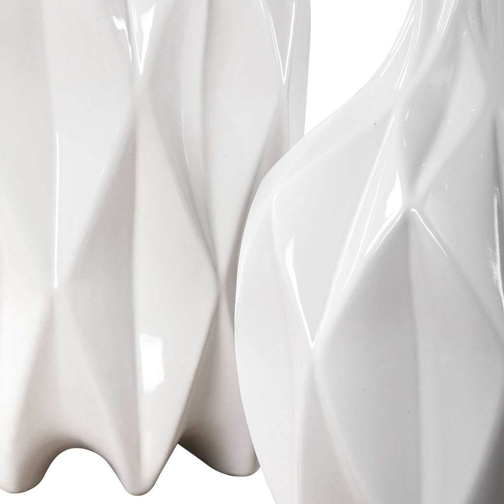 Close-Up View. Modern style emanates from this set of decorative ceramic bottles with an embossed ge
