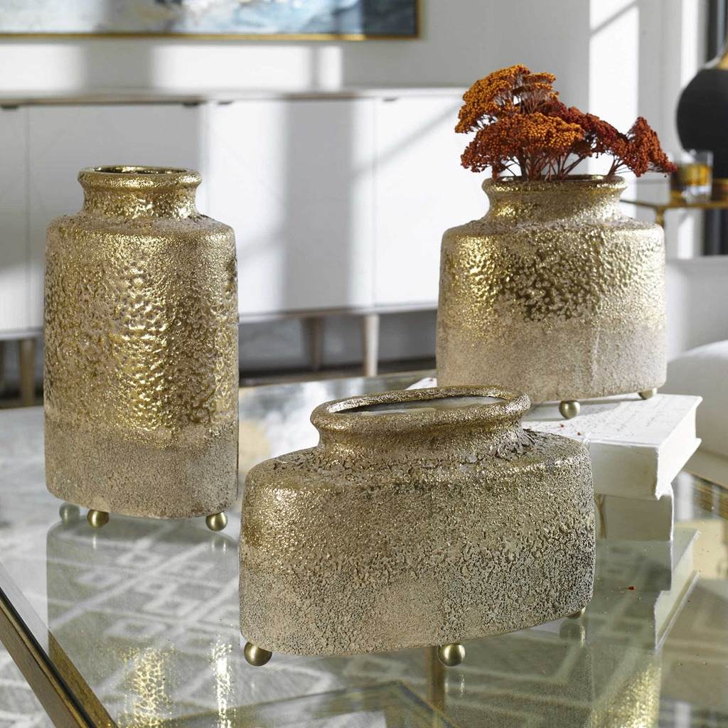 Decorative View. Roughcast ceramic vases, dipped from the top in a metallic golden glaze. Each vesse