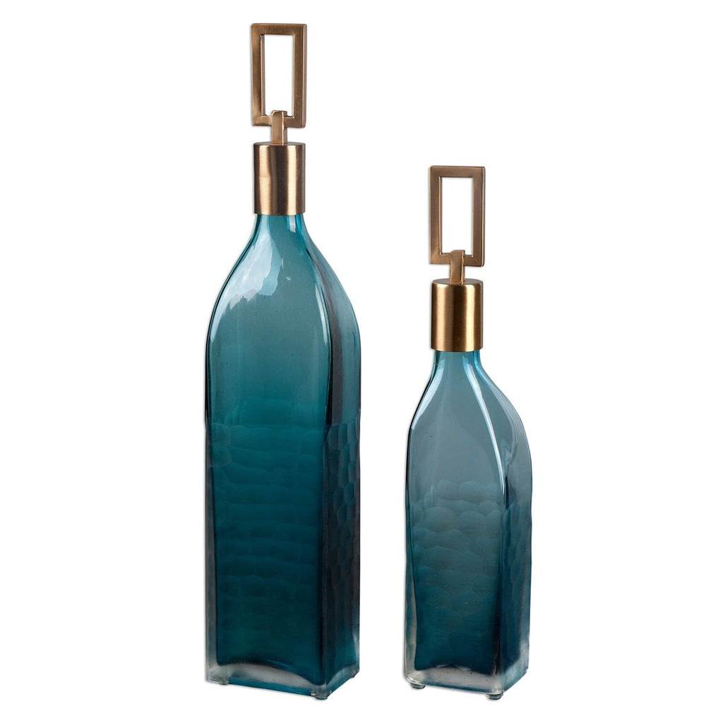 Front View. Thick, textured teal green glass that features ornate, coffee bronze metal stoppers. For