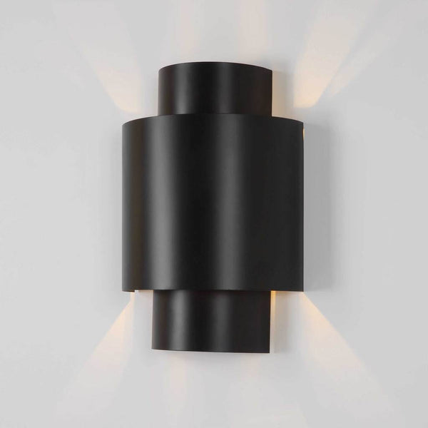 Decorative View. The Youngstown 2 light Sconce features rich dark bronze inter-stacked cylinders tha