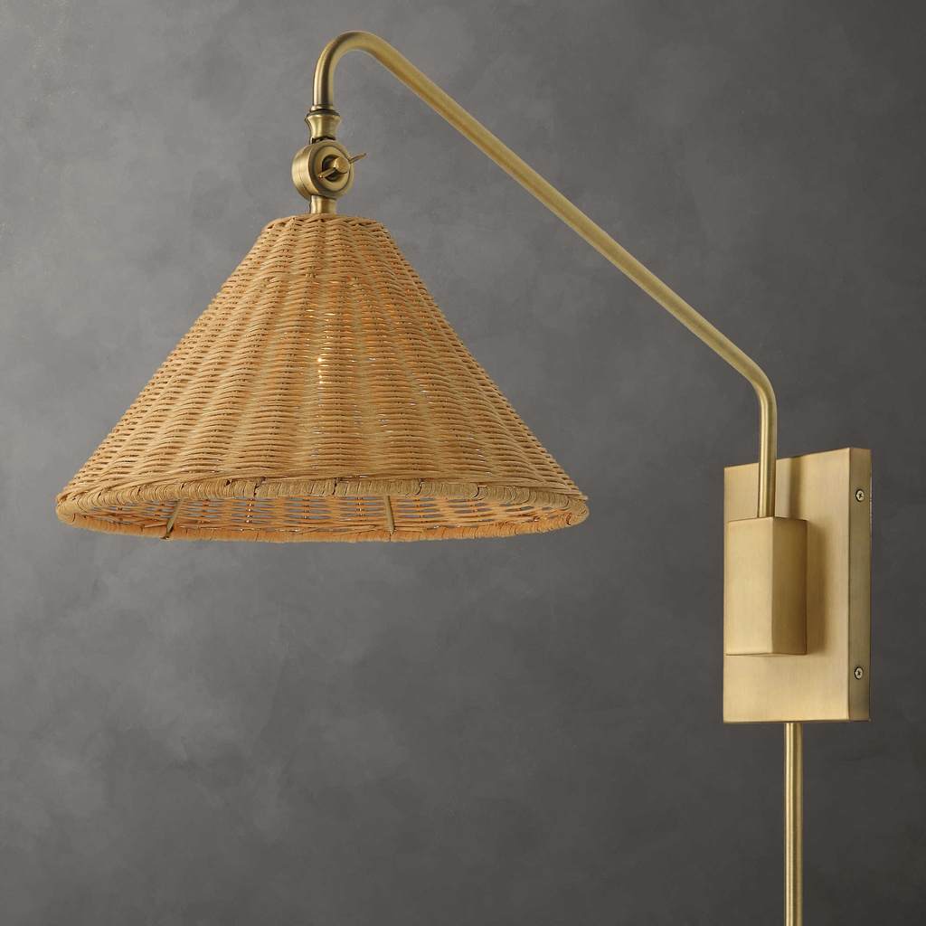Decorative View. The Phuvinh One Light Wall Mount Sconce features woven natural rattan with a tradit