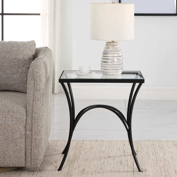 Decorative View. The Alayna End Table features gracefully arched hand forged metal that is finished 