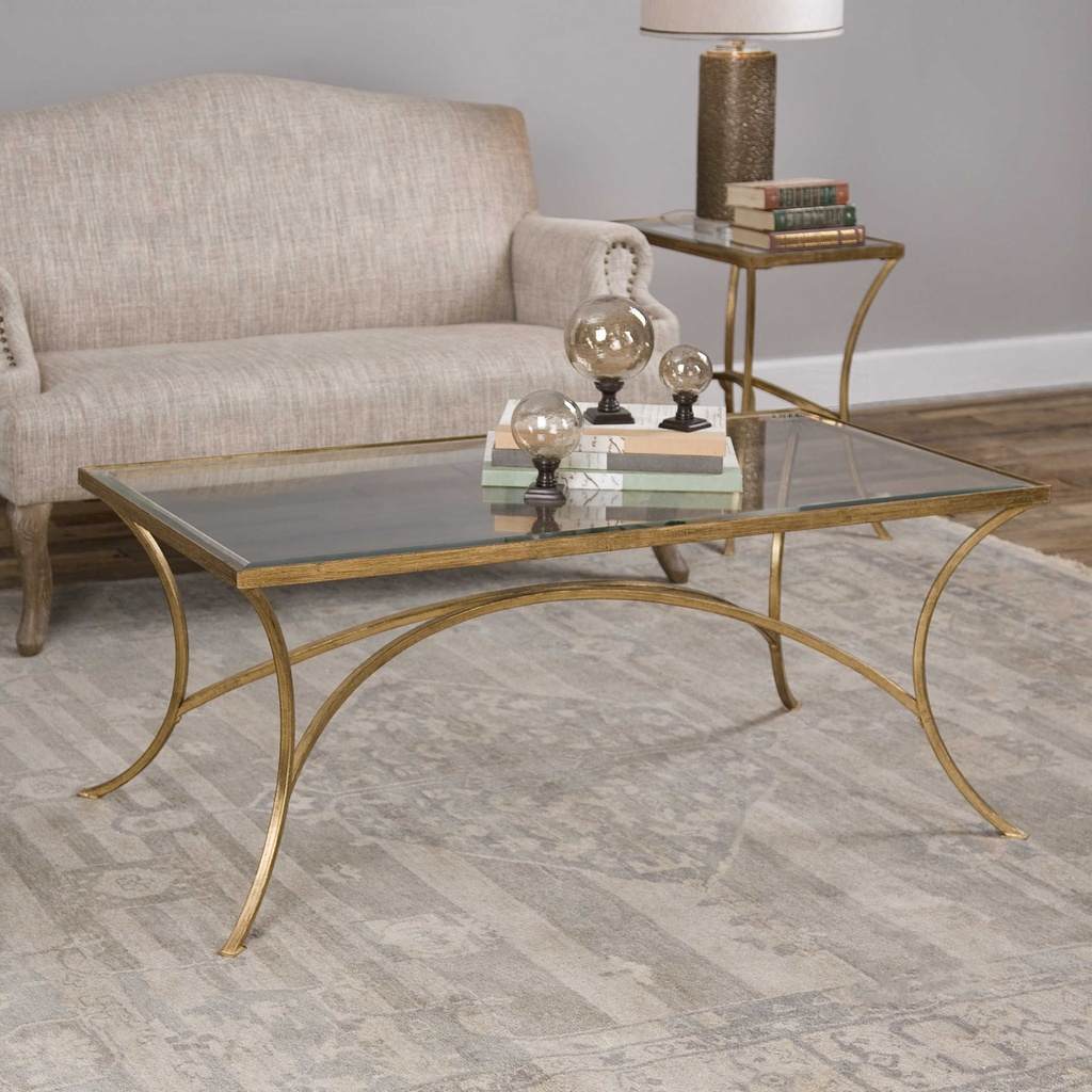 Decorative View. The Alayna Coffee Table features gracefully arched hand forged iron that is finishe