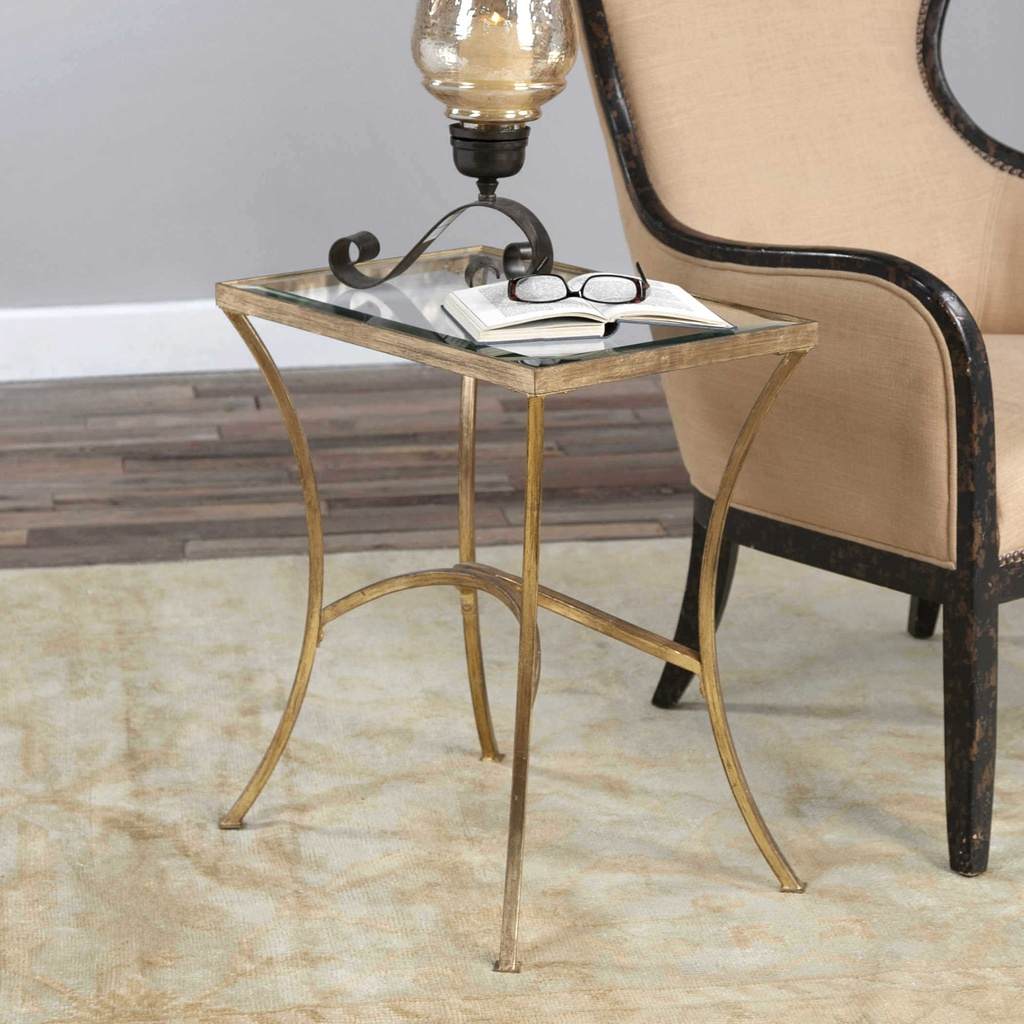 Decorative View. The Alayna End Table features gracefully arched hand forged iron that is finished i
