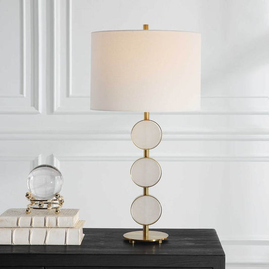 Decorative View. This table lamp brings a soft contemporary flair to any room by featuring three sus