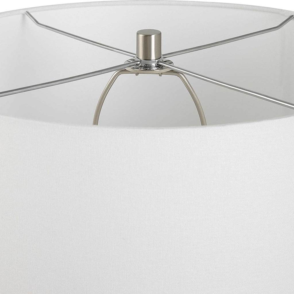 Close-Up View. The Velino Curvy Glass Table Lamp base features a soft gray background with mottled b