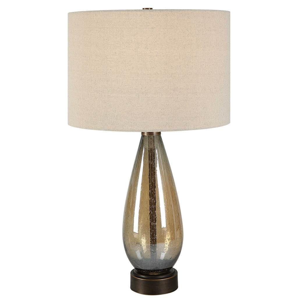 Front View. The Baltic Table lamp showcases a dark amber, teardrop glass base accented with rustic b