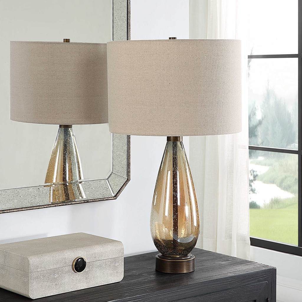 Decorative View. The Baltic Table lamp showcases a dark amber, teardrop glass base accented with rus