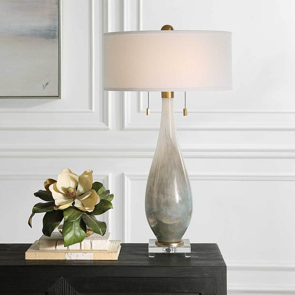 Decorative View. The Cardoni Table Lamp is created from gloss white glass featuring metallic smoked 