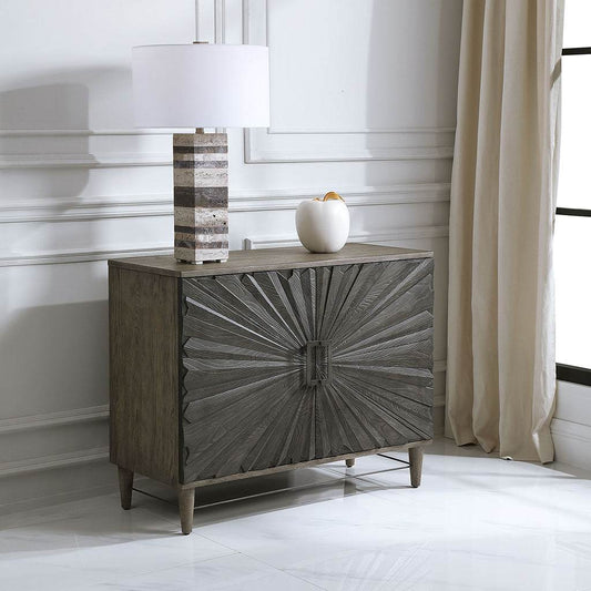 Decorative View. Inspired by global bohemian style, the Shield gray two door cabinet features a stri