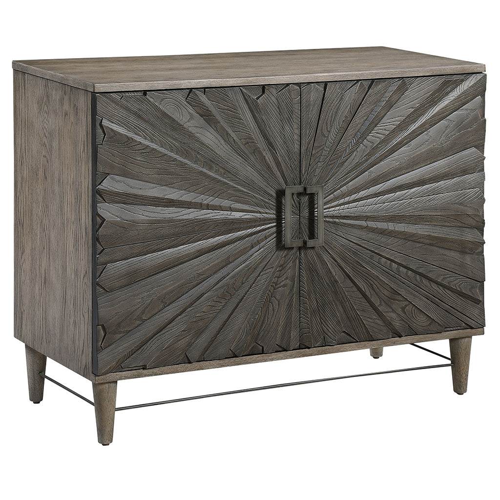 Angle View. Inspired by global bohemian style, the Shield gray two door cabinet features a striking 