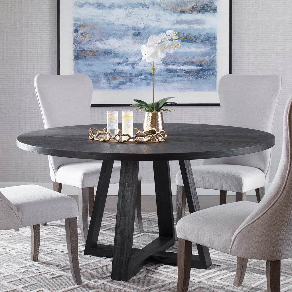Decorative View. With clean casual styling, the Gidran round dining table features a richly grained 